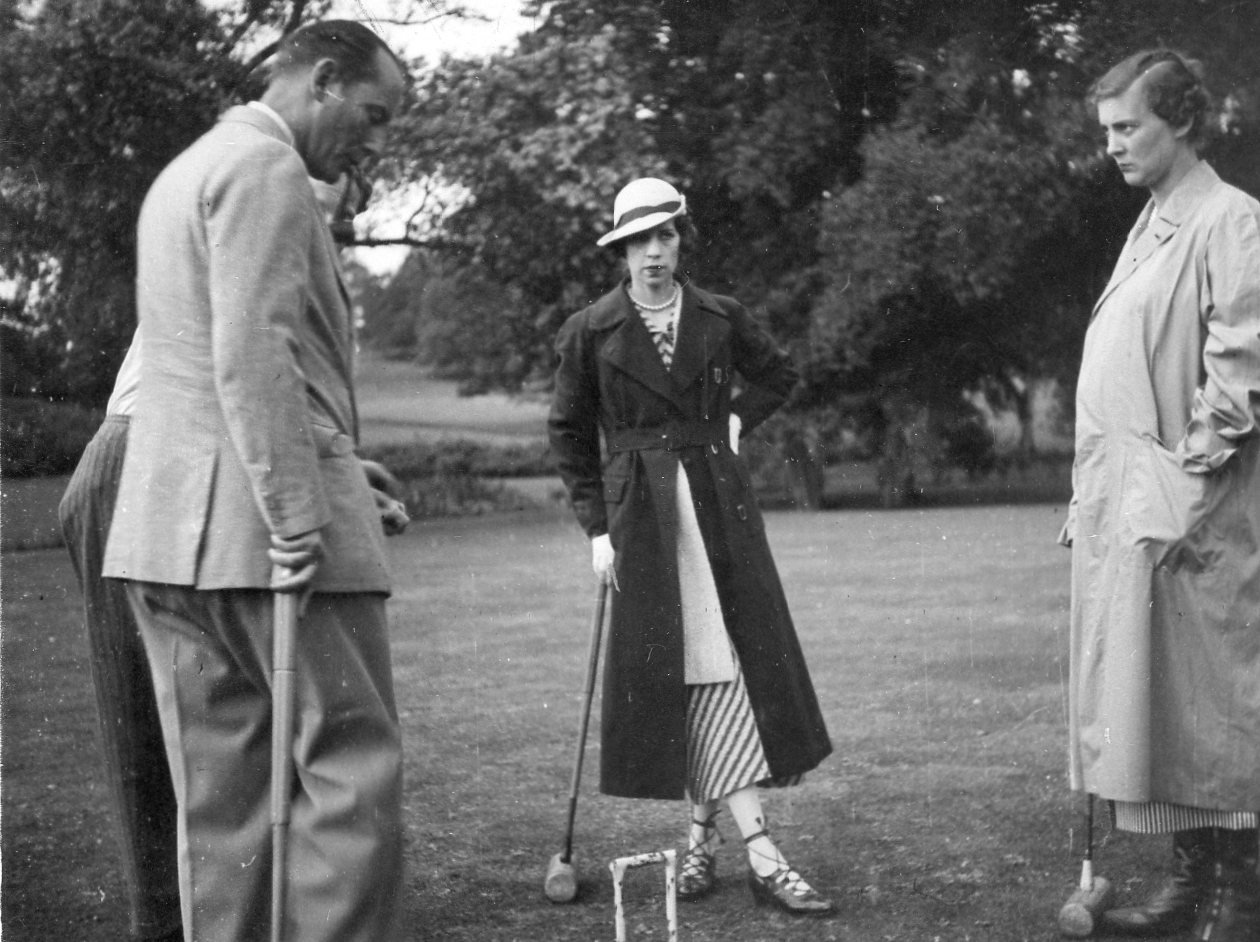 Lady Baillie playing croquet with her guests, c1930