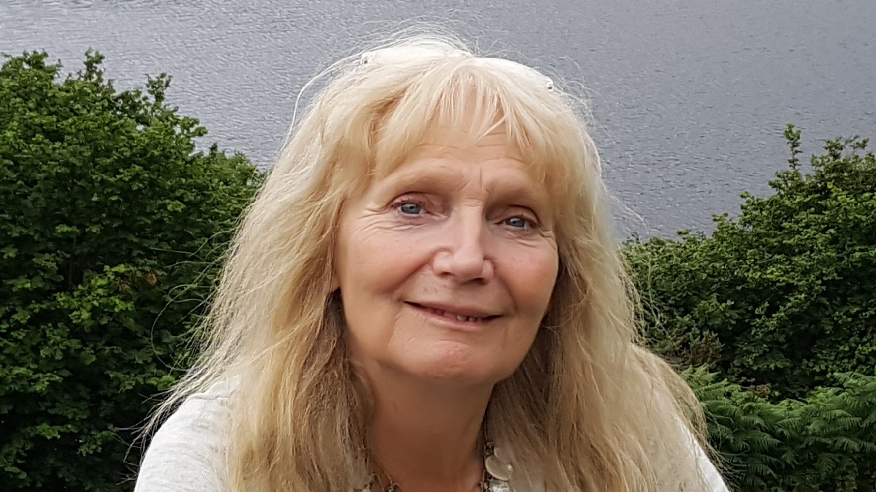 Sculptor Carole Andrews smiling at camera